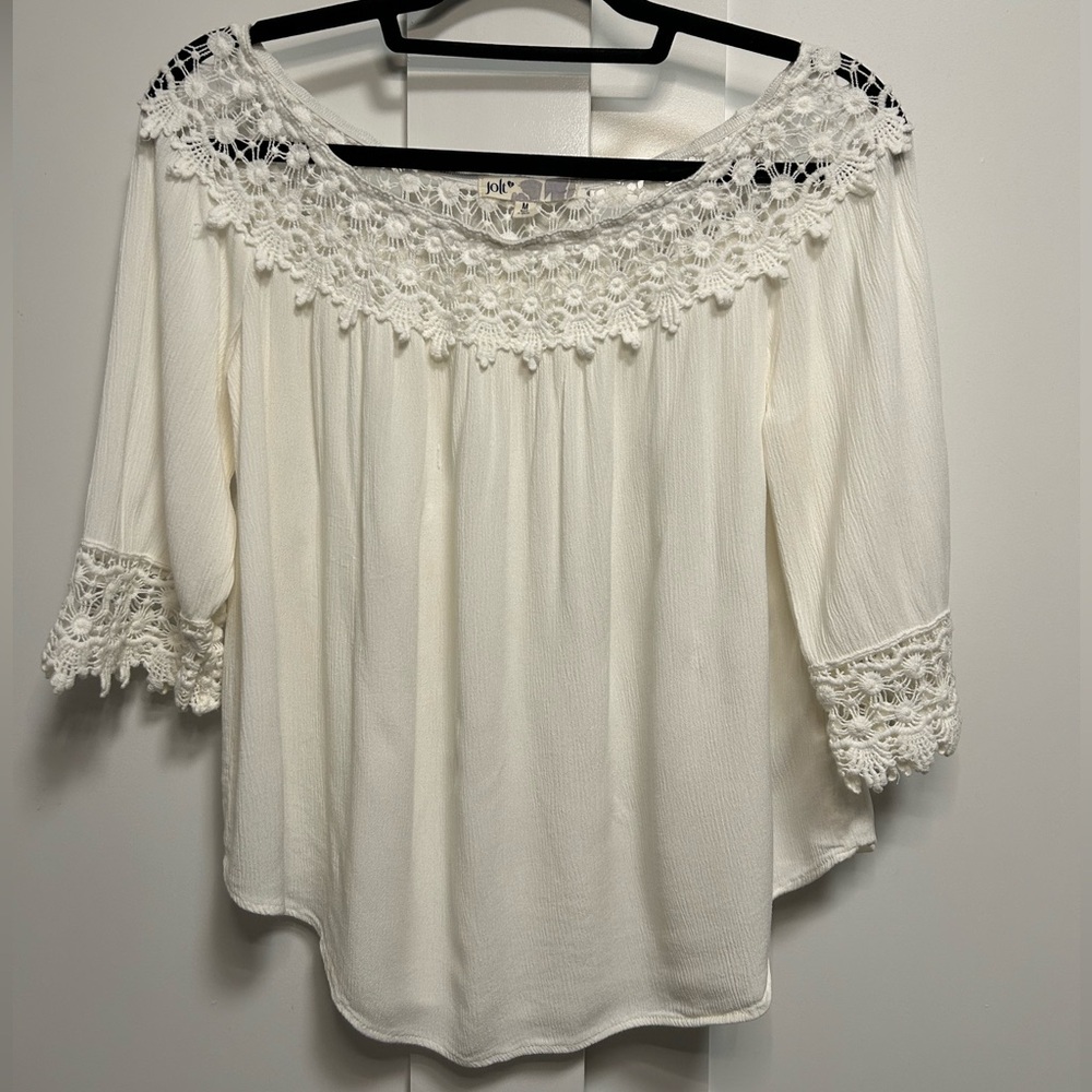 Jolt White lace blouse with 3/4 sleeves and a flowy fit. Size: M